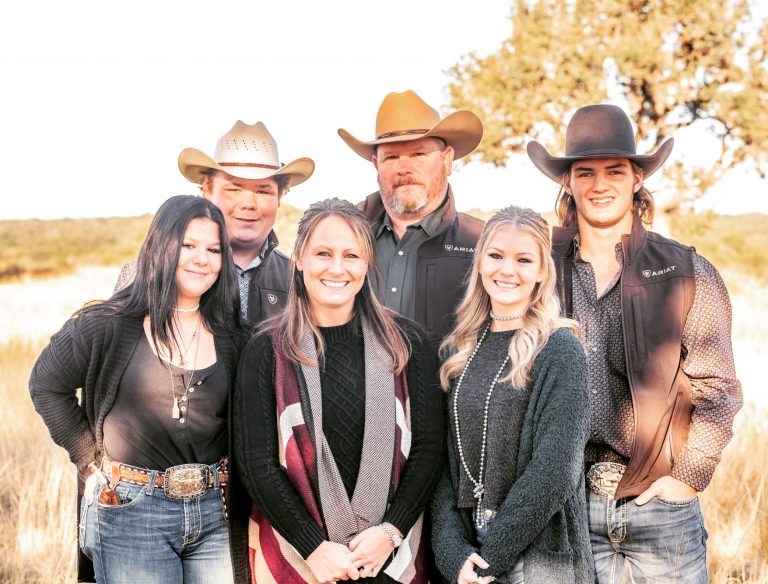 Bryan and Samantha Waligura with their family in a Texas field